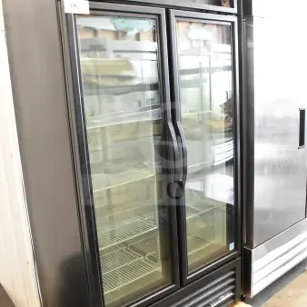 Brand new 2025 True GDM-35F-HC commercial 2-door freezer merchandiser, 115V, visible shelving, slight dents.
