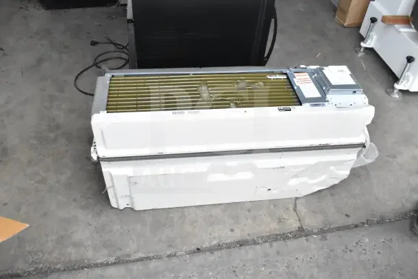 Friedrich ZoneAire Select PTAC air conditioner with heat pump, 12,000 BTU, model PZH12K3SC, 208/230V, 1 phase, in used condition.