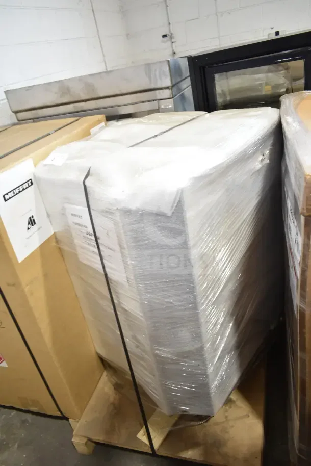 Brand new Moffat USP10M Turbofan 10 Tray Electric Holding Cabinet, 28 7/8" width, in original packaging, marked "scratch and dent."