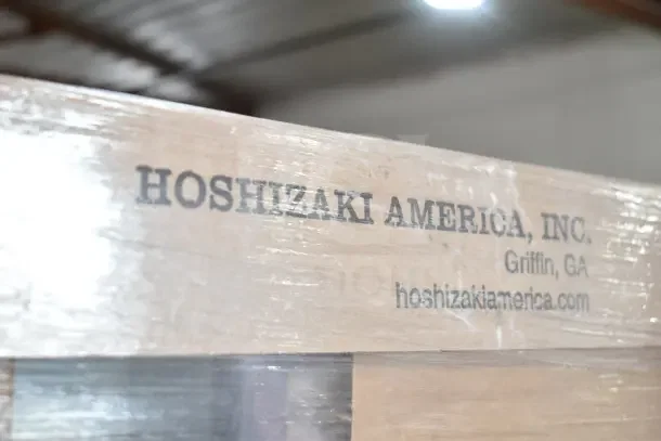 Hoshizaki HXF2A-FG steel crate with "Hoshizaki America, Inc." branding, showcasing boxed reach-in freezer.