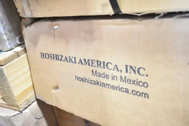 Box labeled "Hoshizaki America, Inc. Made in Mexico." Contains Hoshizaki BB95-G-S back bar refrigerator with 3 glass doors.