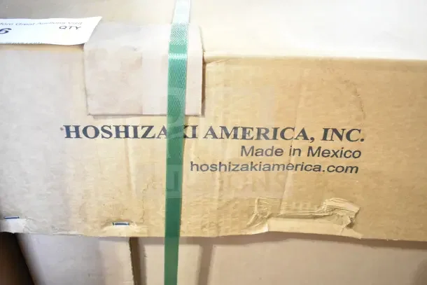 Brand new Hoshizaki CC80-S bottle cooler box, indicating "Made in Mexico." Box shows some dents and scratches.
