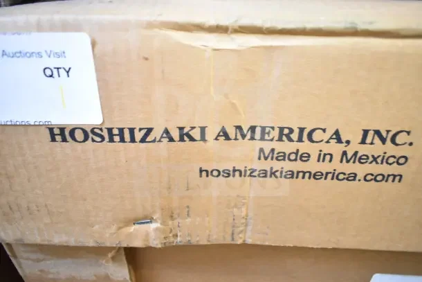 Cardboard box labeled "Hoshizaki America, Inc." indicating a brand new Hoshizaki BB95-G back bar refrigerator.