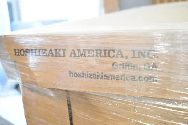 Brand new 2022 Hoshizaki RM-10-HC glass door merchandiser, scratch and dent, 115V, 1 phase, packaging labeled Hoshizaki America.