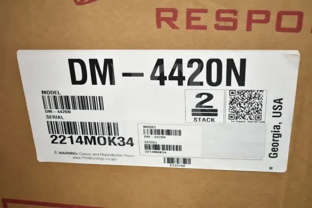 Label on Lancer DM-4420N ice dispenser box, displaying model, serial number 2214MOK34, and "2 Stack" indicator.
