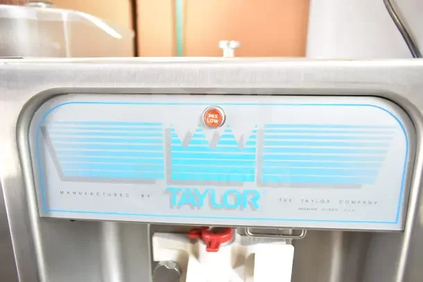 Taylor commercial countertop ice cream machine, single flavor, 208V, stainless steel, "Mix Low" indicator light visible.