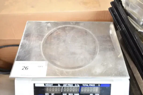 Globe GS130 countertop scale; 30 lb capacity; visible digital display; slight wear; auction tag number 26 attached.