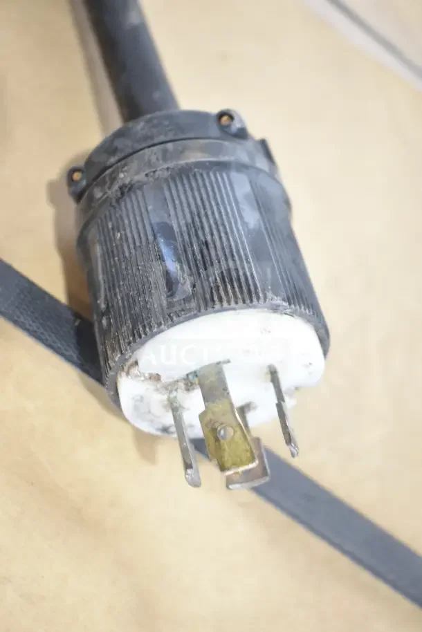 Close-up of a plug for the AccuTemp EGF4803B3600-T1 electric griddle, showing its 480V, 3-phase power connection.