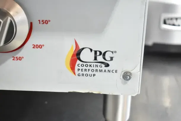 Cooking Performance Group G-CPG-48-M 48" griddle, electric, 208/240V, 1 phase, CPG logo visible, slight crack on panel.