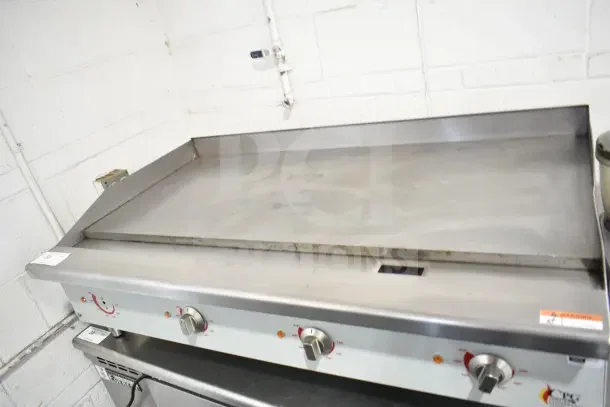 Cooking Performance Group 48" electric griddle, model 351GCPG48M, 208/240V, three knobs, stainless steel, used condition.
