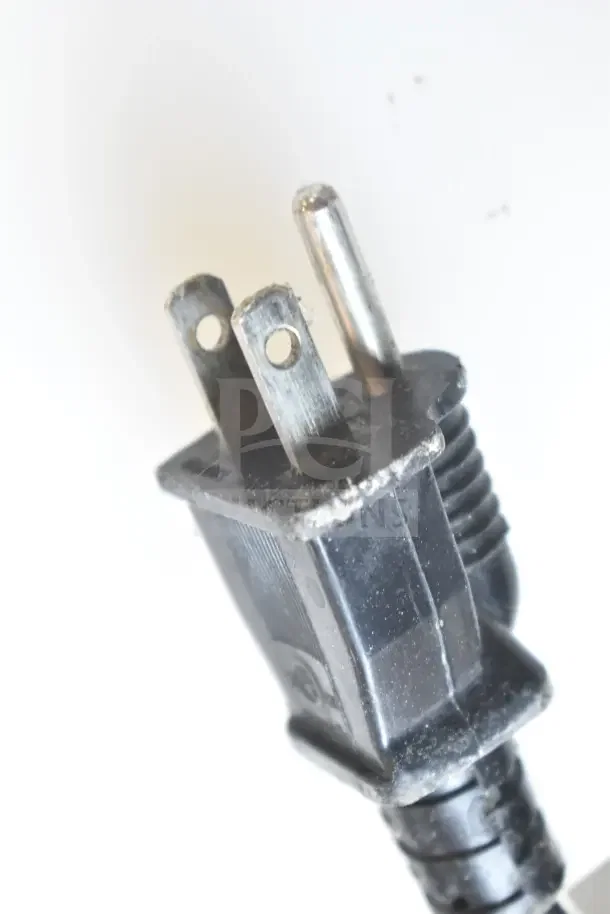 Close-up of a standard 3-prong plug for Avantco 177W50 Commercial Countertop Food Warmer, showing slight wear.