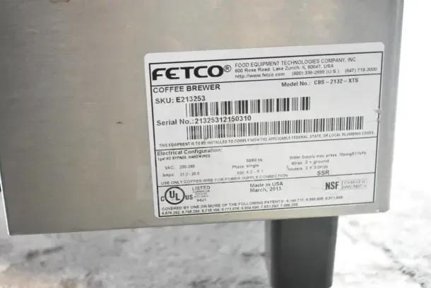 Fetco CBS-2132-XTS coffee machine label, showing model, serial number 21325312150310, electrical specs, and NSF certification.