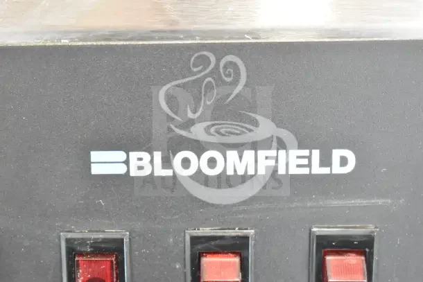 Bloomfield 8571 Countertop Coffee Machine, 3 Burners, 120V, 1 Phase, features red toggle switches and logo on front panel.