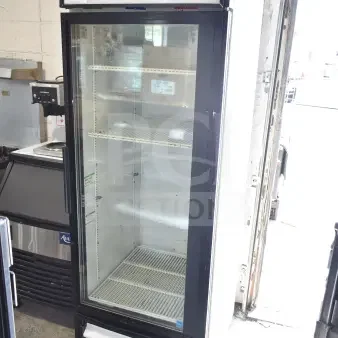 True GDM-23 commercial single door reach-in cooler merchandiser. 115 volts, 1 phase. Visible branding, clean condition.