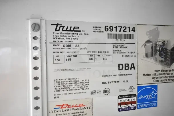True GDM-23 cooler label showing model, voltage 115V, 1 phase, serial number 6917214, NSF and Energy Star certified.