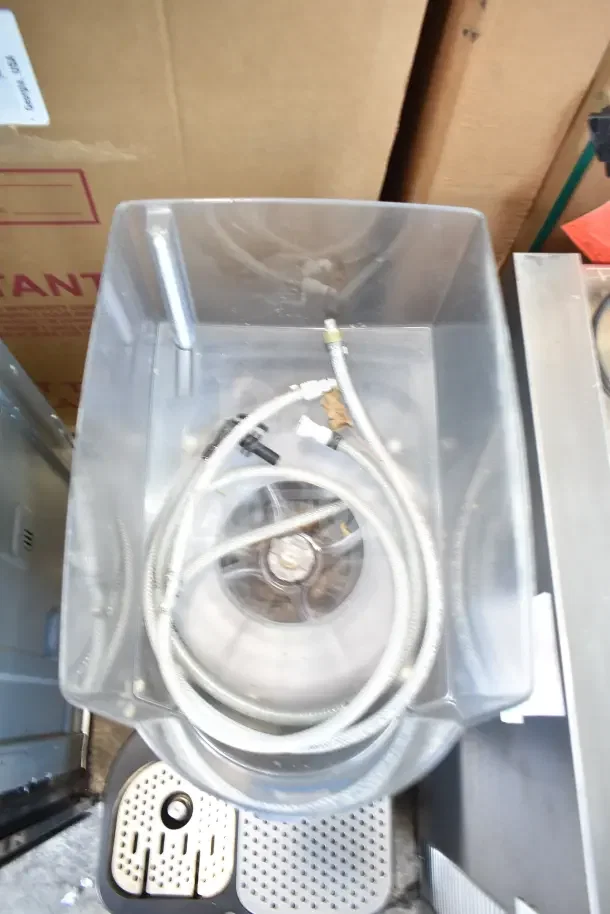 Taylor X83684-12 commercial frozen beverage mixer, 115V, 1 phase, includes hoses, used countertop unit.