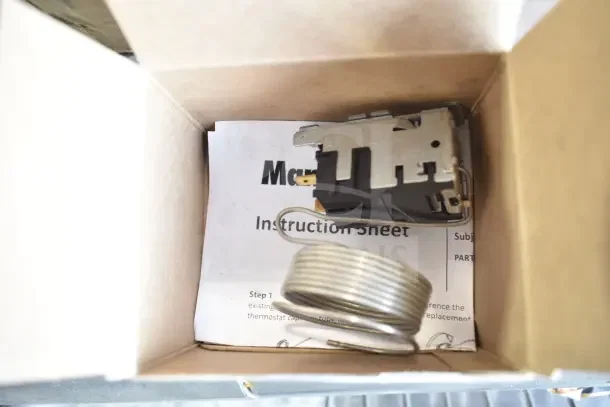 Box containing a mounting bracket with a coiled wire and an instruction sheet. Item is brand new, scratch and dent condition.
