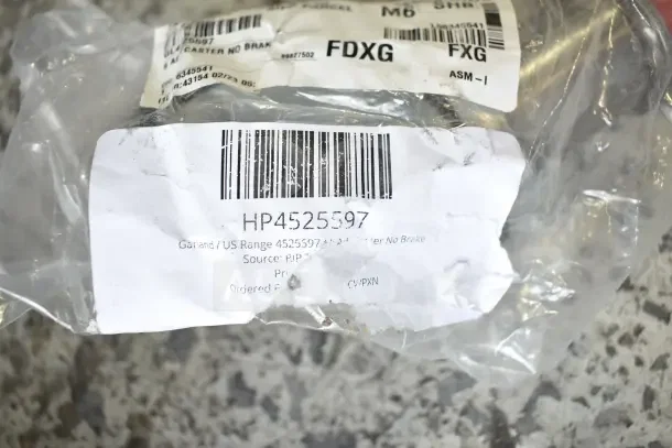 Brand new gasket with a scratched label showing barcode HP4525597. Package indicates Garland/US Range caster, no brake.