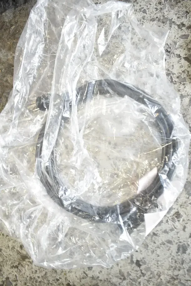 Plastic-wrapped millivolt harness included in a 28-piece scratch and dent auction. Items are brand new.