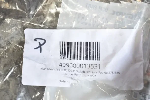Assorted new scratch and dent parts including gasket, harness, bracket, knob, and caster. Label reads "Manitowoc 000013531 Switch Pressure."