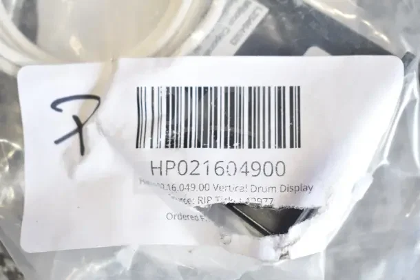 Clear plastic package with barcode and text "HP021604900," containing various new scratch and dent items.