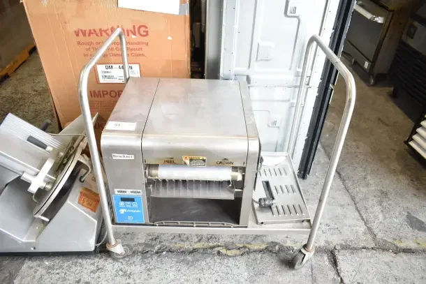 AJ Antunes GST-2H commercial countertop horizontal bun toaster on cart, 208-240 volts, 1 phase, visible controls and labels.