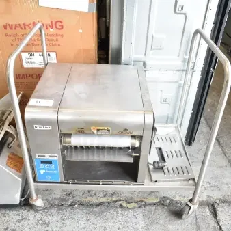 AJ Antunes GST-2H commercial countertop horizontal bun toaster on cart, 208-240 volts, 1 phase, visible controls and labels.