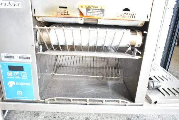 AJ Antunes GST-2H commercial bun toaster on cart, 208-240V, 1 phase. Visible caution label; used condition.