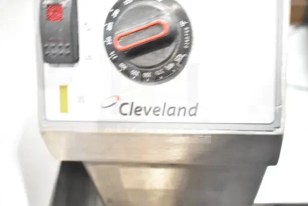 Cleveland commercial manual tilt braising pan, gas-powered. Features control knob and Cleveland logo. Appears in used condition.