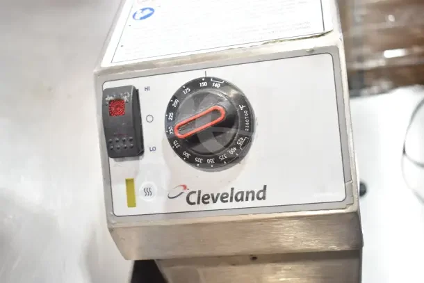 Cleveland gas-powered braising pan control panel with temperature dial, brand logo, and operational instructions.