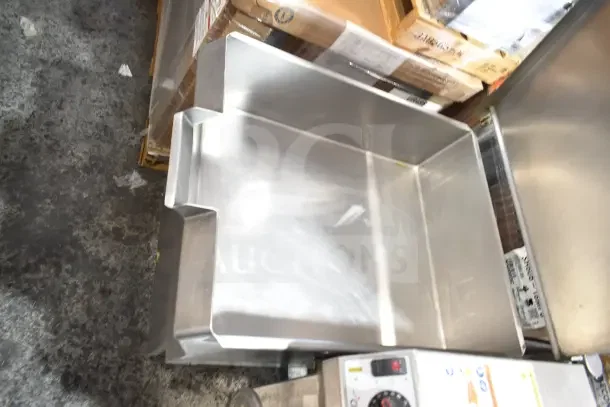 Cleveland commercial manual tilt braising pan, gas powered, excellent condition, stainless steel, visible control knobs.