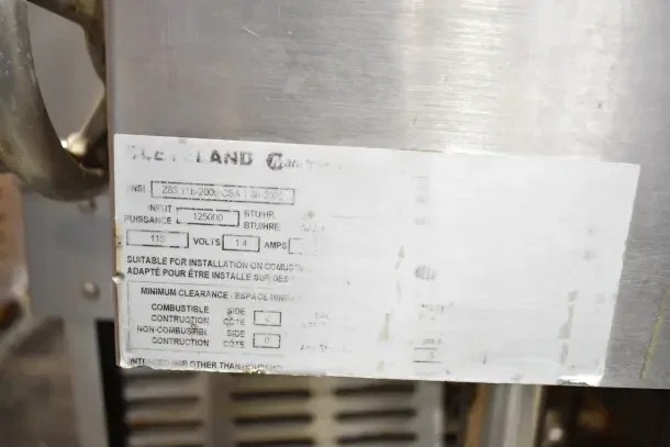 Cleveland commercial gas braising pan label showing model details and installation requirements.