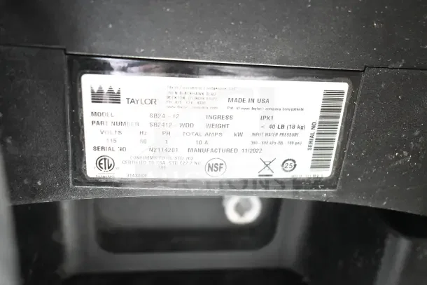 Label on 2022 Taylor SB24-12 Commercial Countertop Frozen Beverage Machine showing model, voltage, and manufacturing details.