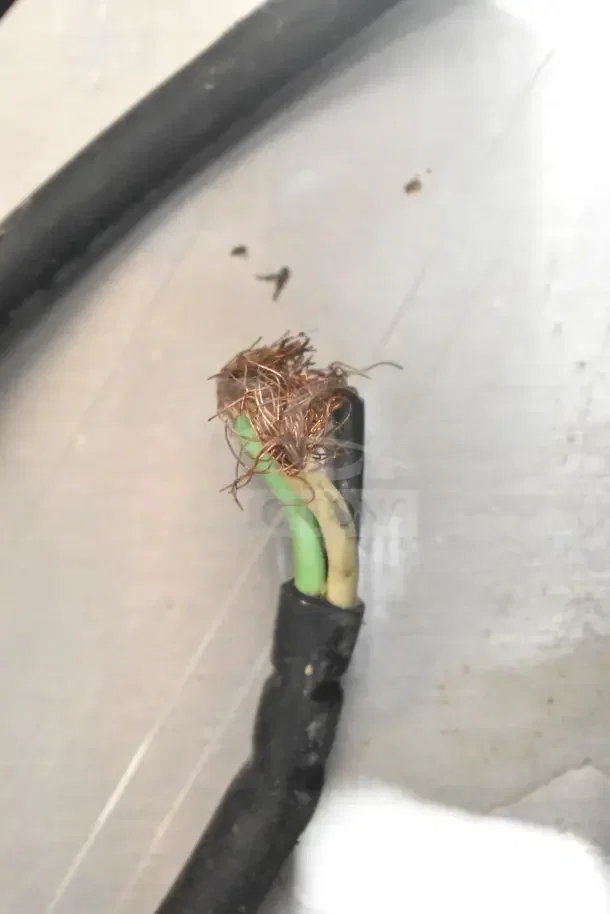 Damaged power cord of Prince Castle DHB2PT-33KFCB commercial holding bin showing exposed copper wires.