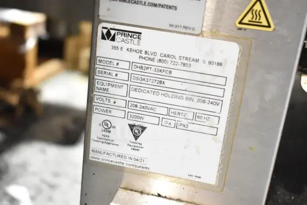 Prince Castle DHB2PT-33KFCB holding bin label, 208-240V, 3200W, manufactured 04/21, UL listed commercial appliance.