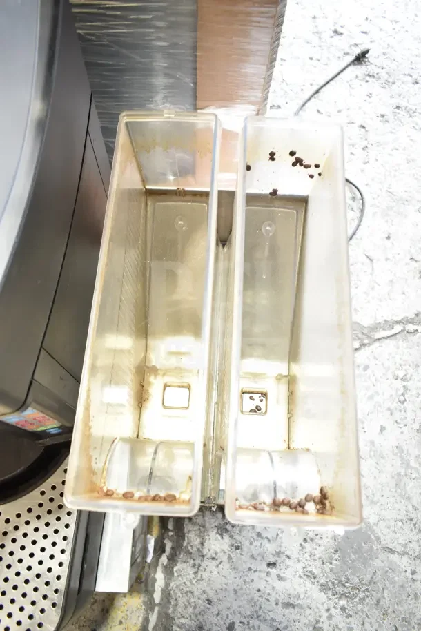 Bunn MHG 35600.0011 coffee bean grinder with 2 hoppers, missing lids. 120V, 1 phase. Used condition.