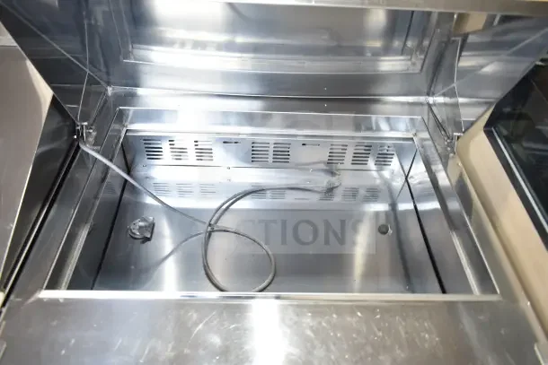Norlake SMP36-15 commercial sandwich salad prep table interior, showcasing stainless steel finish and power cord.
