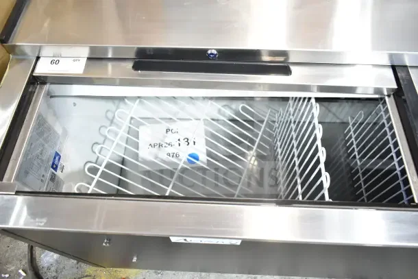 Avantco 178HBB95HC 95" Black Horizontal Bottle Cooler, brand new with minor scratches, 115V. Interior view shows wire racks.