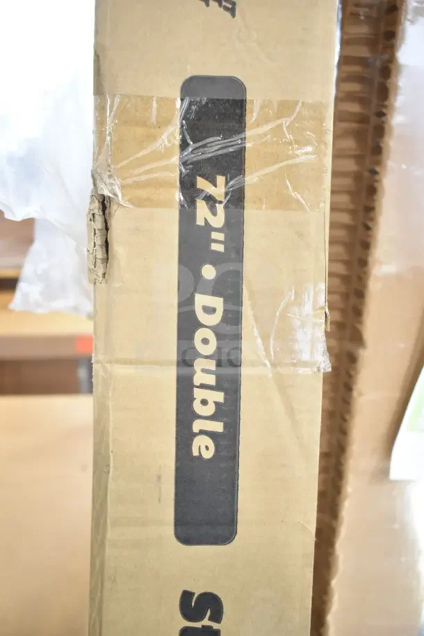 Cardboard box labeled "72" Double Strip," slightly dented, containing a ServIt 423SW72TLHDBLA lighted double strip warmer, dual toggle controls, 120V.