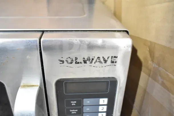 2018 Solwave 180MW1200T commercial microwave oven, stainless steel, keypad control, visible wear on branding.