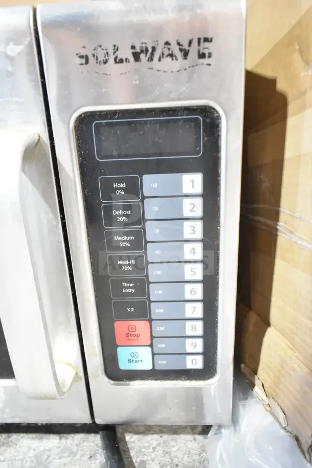 2018 Solwave 180MW1200T Commercial Microwave; stainless steel, keypad controls, 120V, used condition, slight wear.