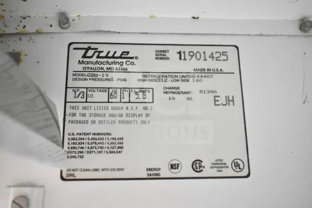 True GDM-19 Cooler Merchandiser label showing model details, 115 volts, 1 phase, refrigerant R134A, NSF certified.