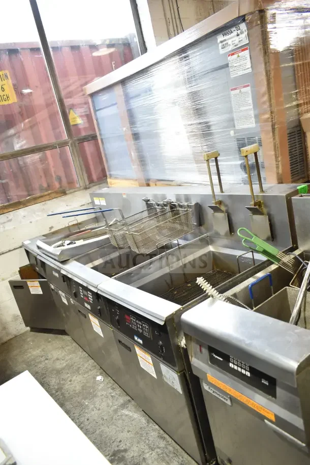 Giles EOF-24 stainless steel 3-bay electric fryer with Giles EOF-BIB dumping station, on commercial casters, 480V, 3-phase.