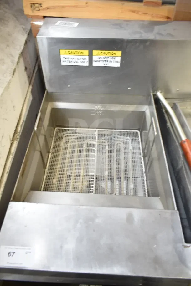 Giles EOF-24 stainless steel 3 bay fryer with EOF-BIB dumping station on casters, 480V, 3 phase, caution labels visible.