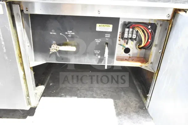 Giles EOF-24 stainless steel commercial fryer control panel, showing vat fill, pump oil return, and fryer drain labels.