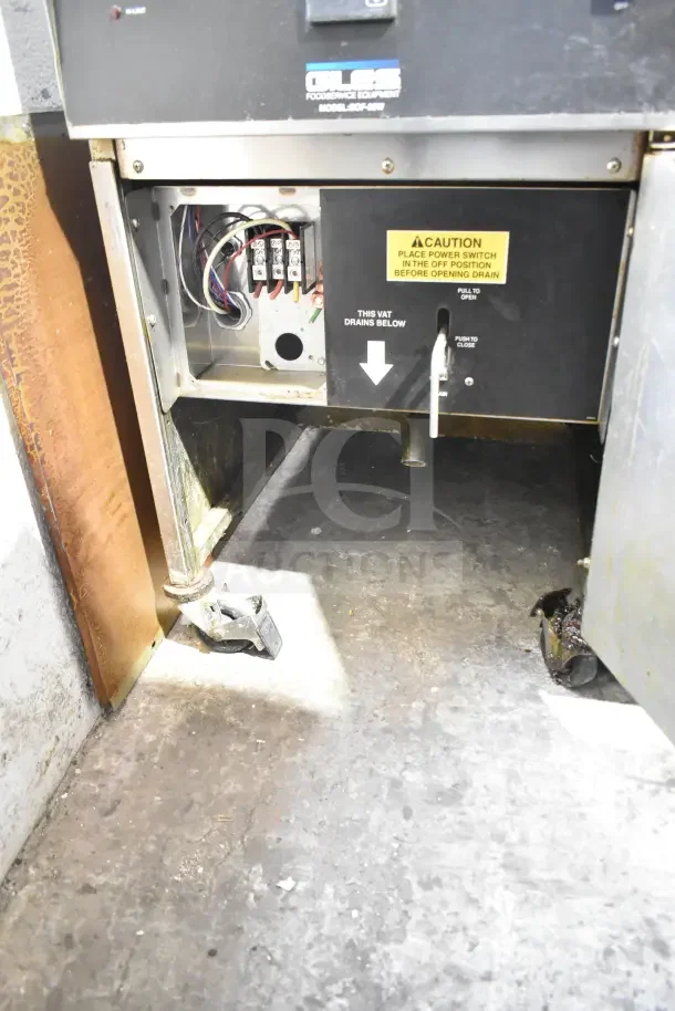 Giles EOF-24 stainless steel electric 3-bay fryer with EOF-BIB dumping station on casters, 480V, 3-phase. Model label visible.