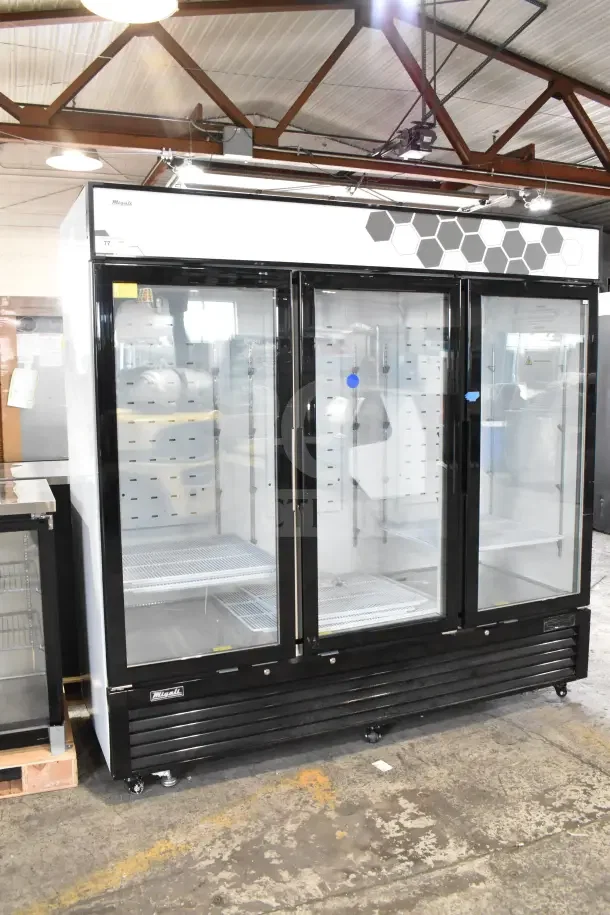 Brand new scratch and dent Migali C-72FM-HC 3-door reach-in freezer merchandiser. Model C-72FM-HCN89C014, 115/208-240V, 1 phase.
