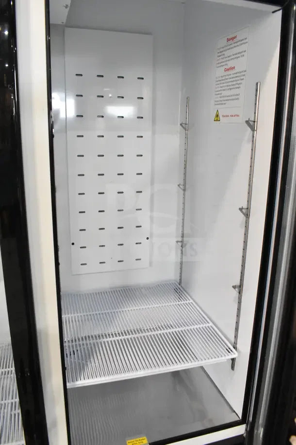 Brand new 2024 Migali C-72FM-HC Commercial 3 Door Freezer, 115/208-240V, scratch and dent, interior shelving shown.