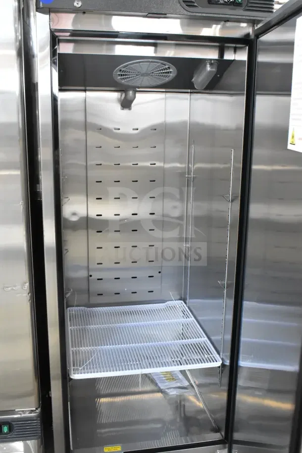 Brand new Migali commercial single-door reach-in cooler, 115V, 1 phase, on commercial casters. Scratch and dent condition.