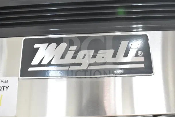 Migali logo plate on stainless steel exterior of 2023 C-3RB-HC Commercial Cooler. Visible scratch and dent condition.